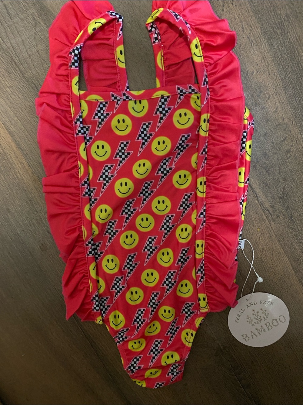 Girls pint smiley face swimsuit with ruffles NWT size 3t